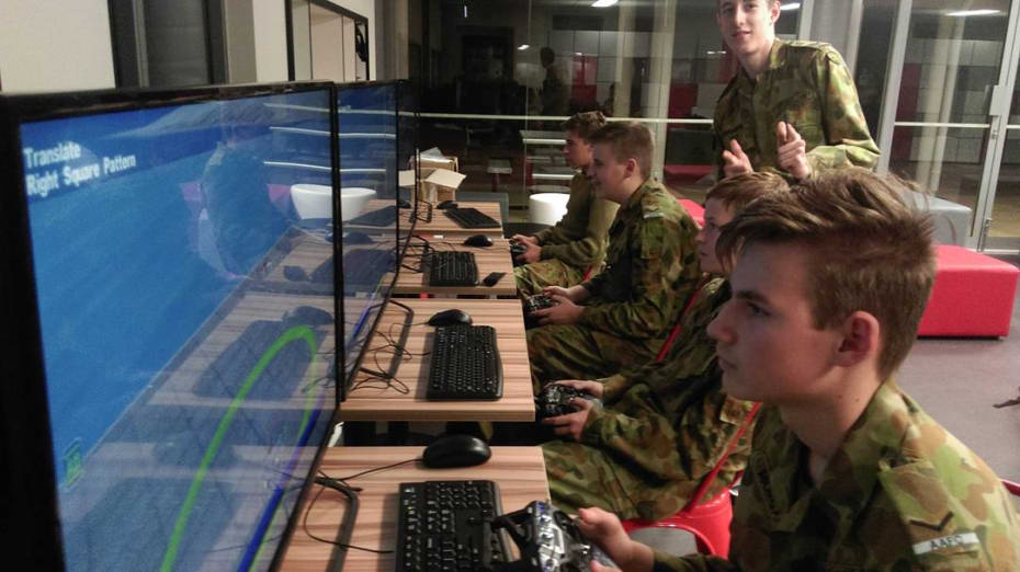 Australian Air Force Cadets at No 723 Squadron in Joondalup
Western Australia give the 'thumbs up' while using their new AeroSIM-RC flight simulators.